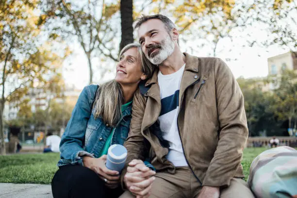 Two people holding hands in a moment of connection